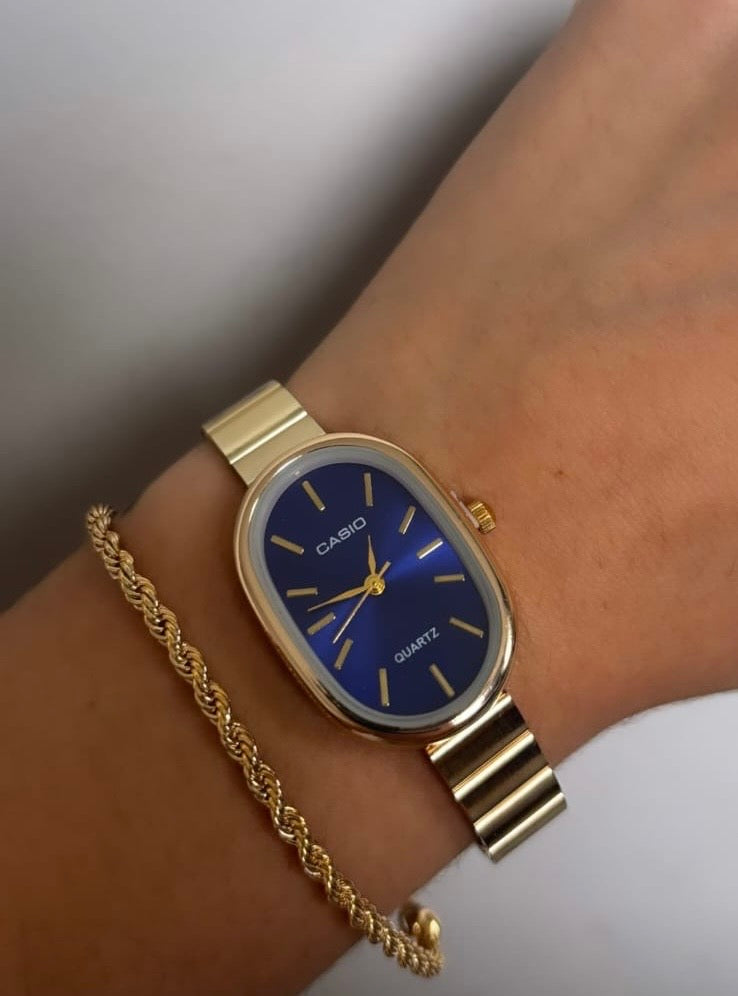 Relógio Cássio dourado fundo azul